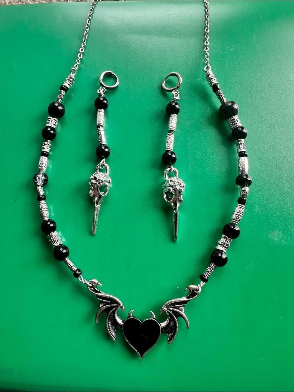Women's Black Heart Wing Pendant Necklace with Matching Bird Skull Earrings